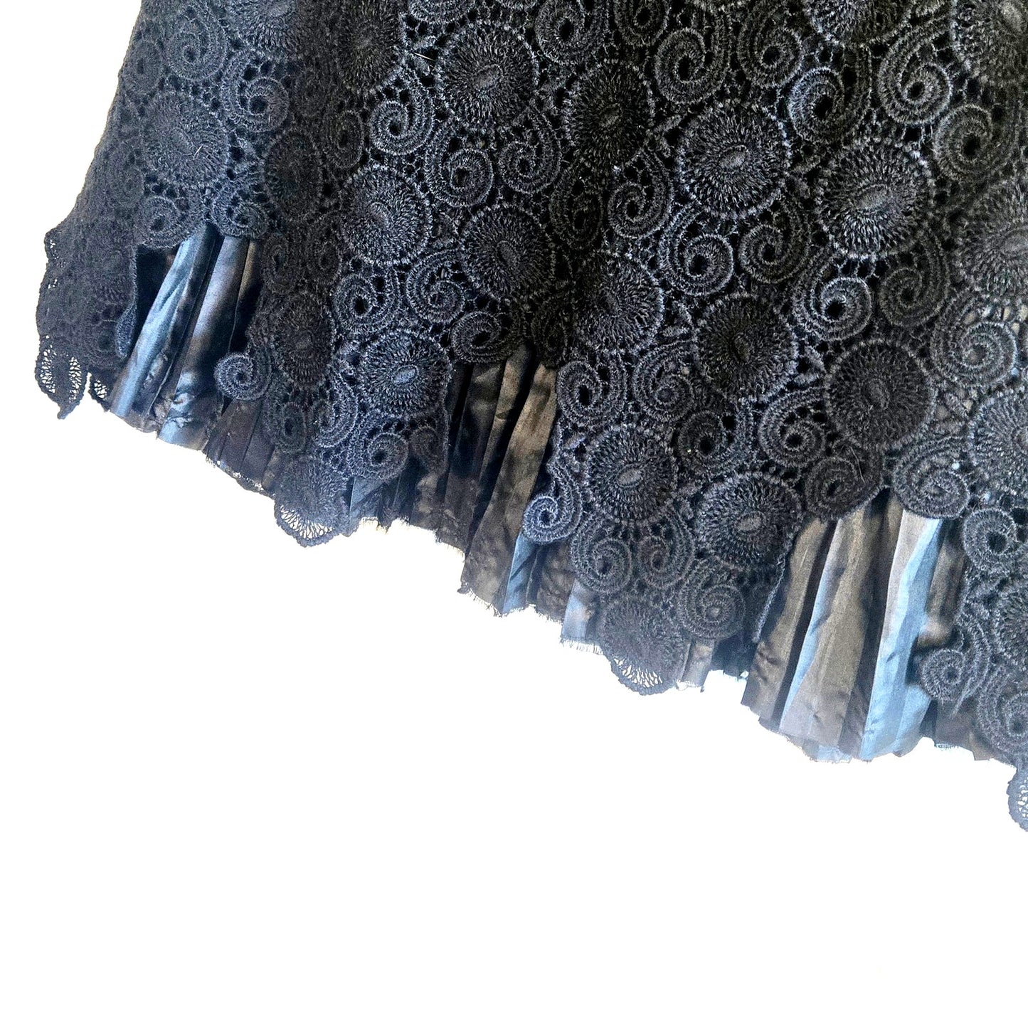 Size 2 – Anthropologie black crochet overlay skirt with pleated satin hem